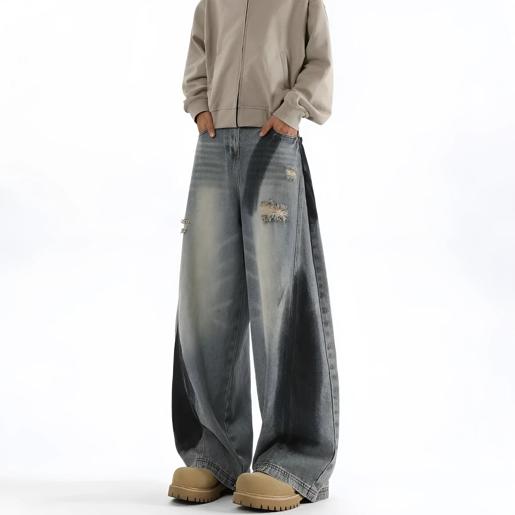 Men's blue loose fit ripped jeans with American-style splash-ink wash and distressed detailing