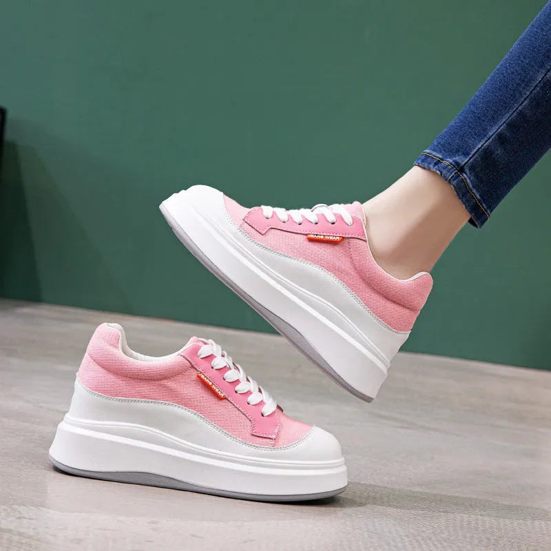 Women's beige and pink leather board shoes with a thick sole, shown from the side.