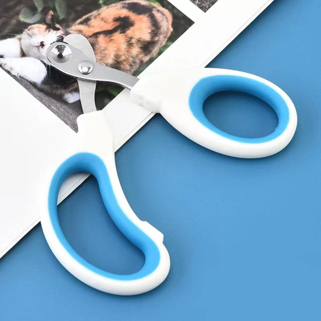 Blue cat nail clippers with circular hole and cushioned handles for trimming pet nails