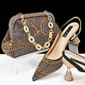 Women's pointed toe high heels with rhinestone detailing and matching small bag in blue colour