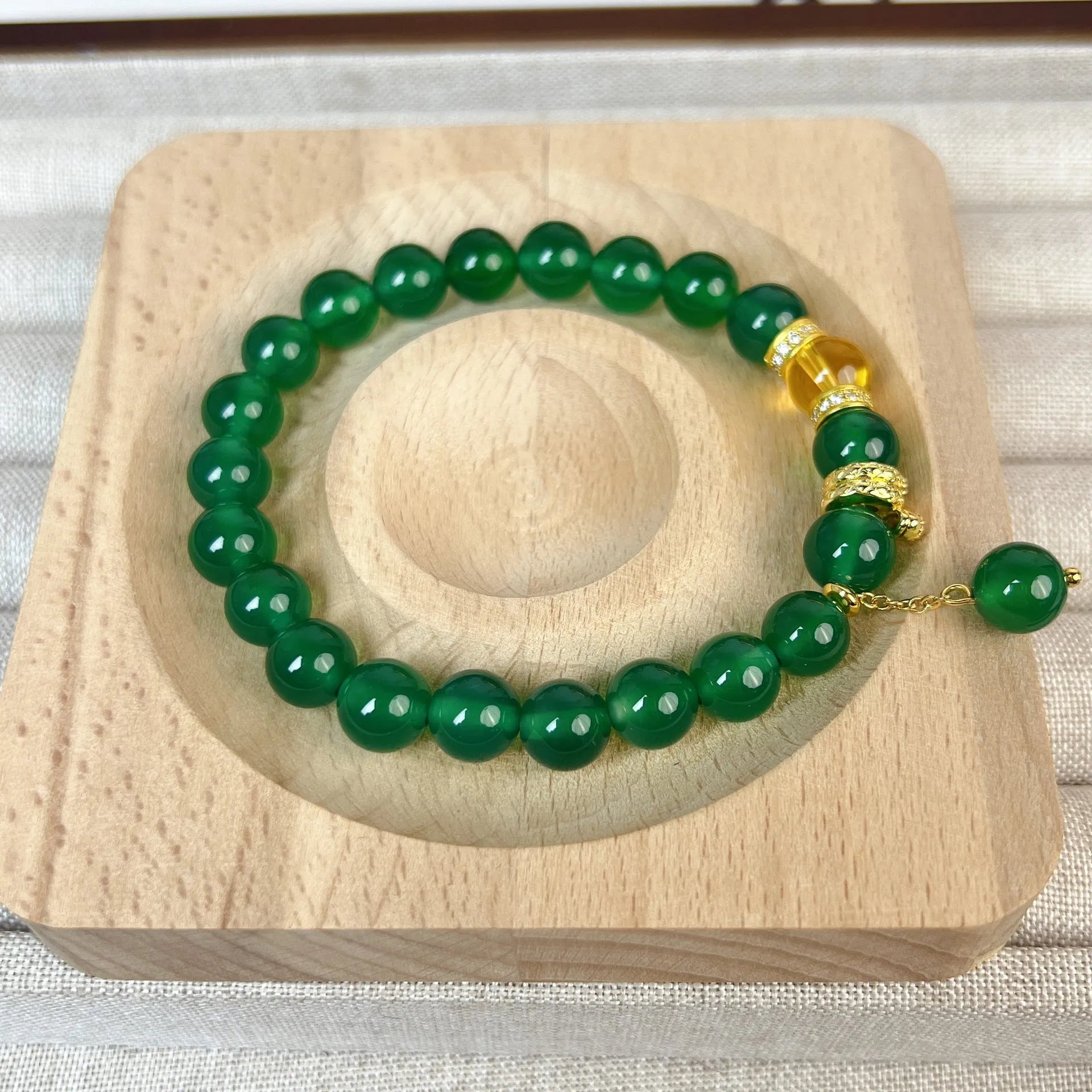 Green chalcedony and red agate roll wealth snake bracelet with copper fittings on wrist