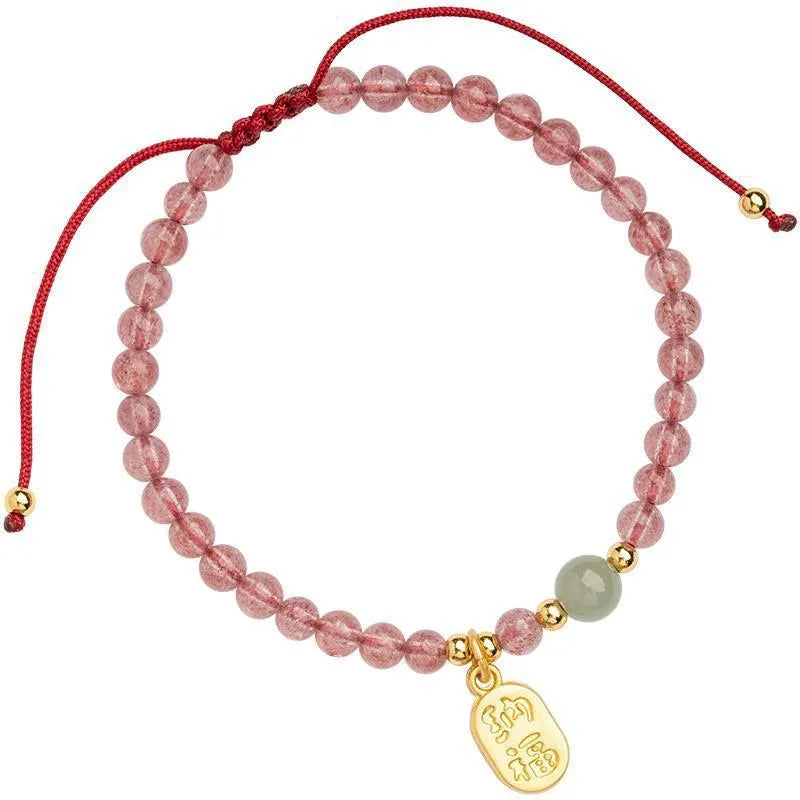 Red rope bracelet with pink strawberry quartz and dark red garnet beads, hand-woven.