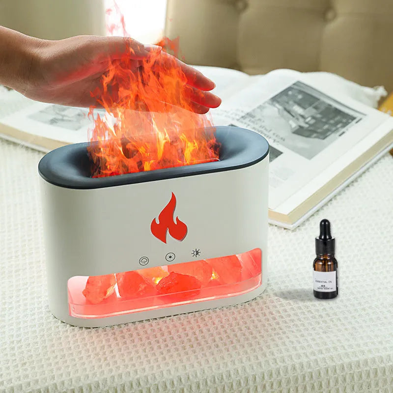 Square white flame effect humidifier and aromatherapy diffuser with coloured 3D light on a desk.
