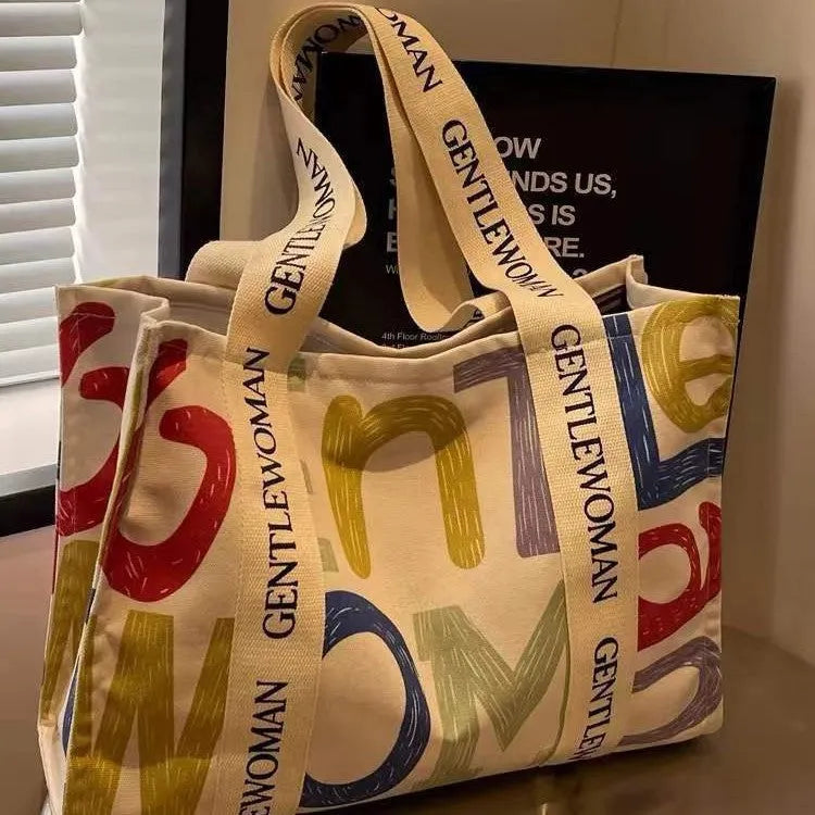 Canvas women's tote bag with printed design showing 45cm width and shoulder strap