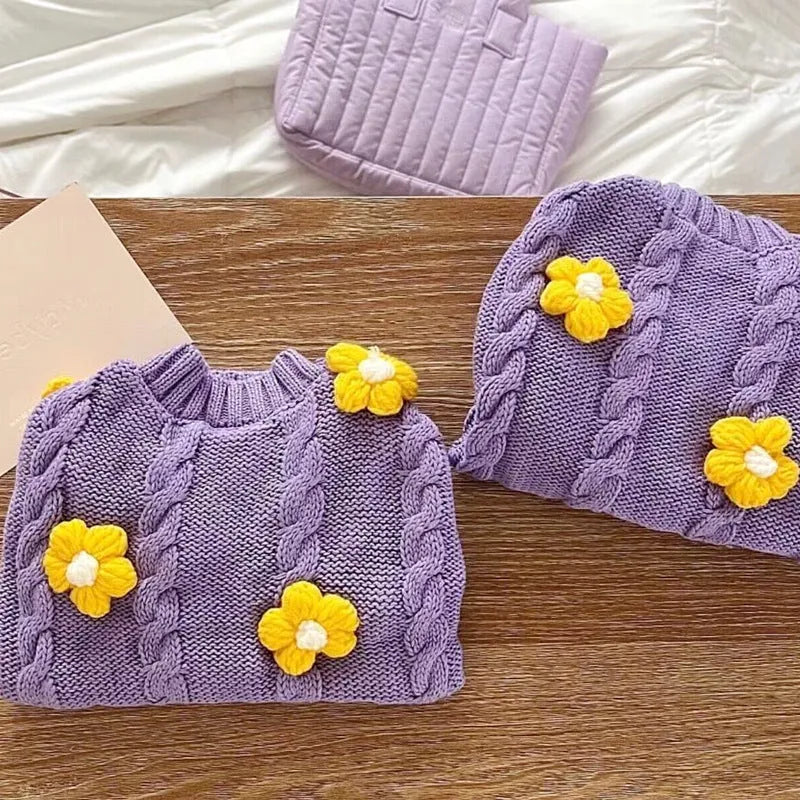 Purple knitted dog clothing with floral pattern showing size options for small pets