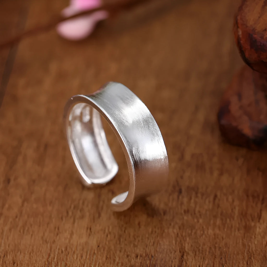 Geometric adjustable opening frosted sterling silver ring on finger
