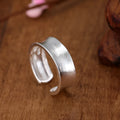 Geometric adjustable opening frosted sterling silver ring on finger
