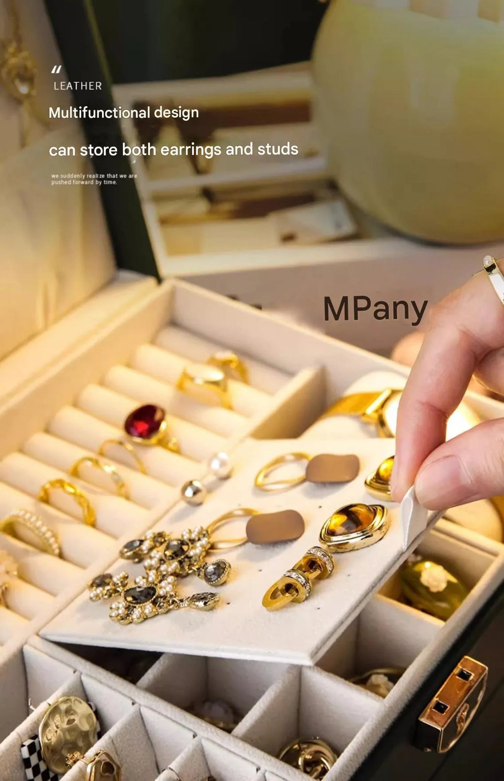 Leather jewellery storage box with three drawers open, showing storage for necklaces, earrings, and bracelets.