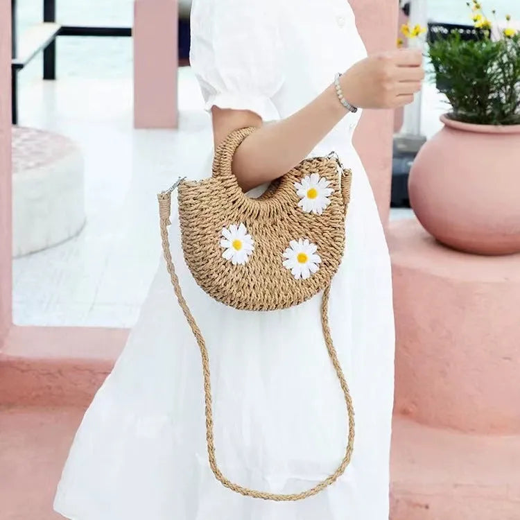 Women's light brown straw-weaved crossbody bag with daisy decoration, 25cm wide