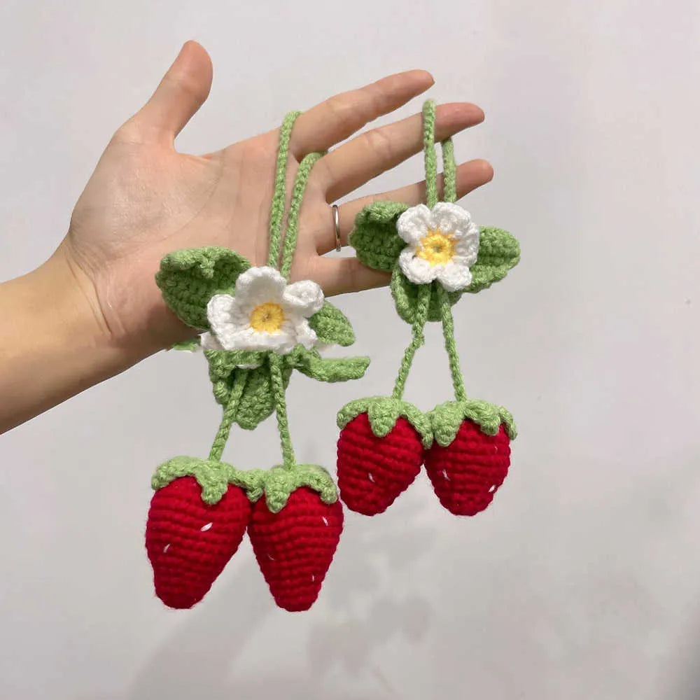 Handmade strawberry weaving car pendant with cotton hemp materials showing detailed stitching