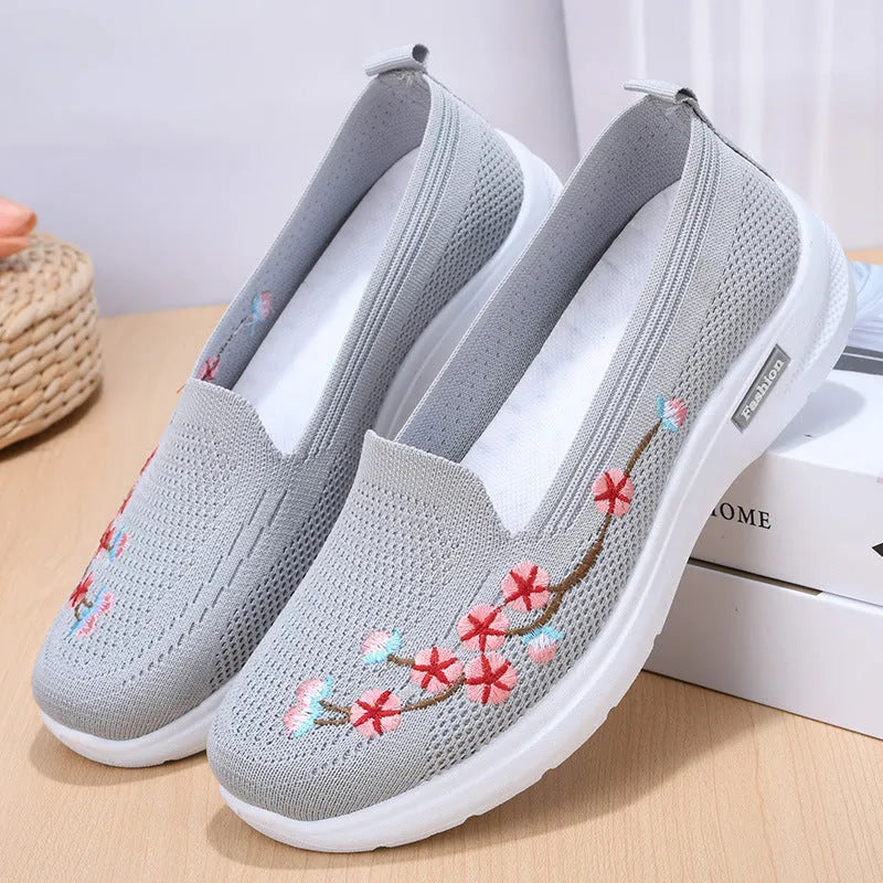 Women's low-heel woven casual pumps with flower embroidery and an anti-slip sole in wine red.