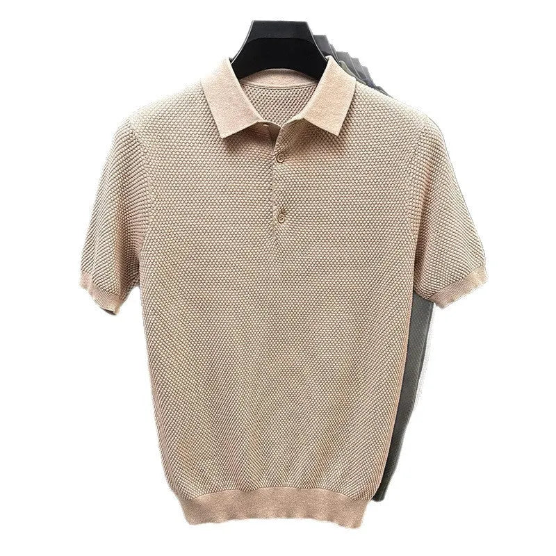 Man wearing a loose navy blue short sleeve cotton pullover sweater casually.