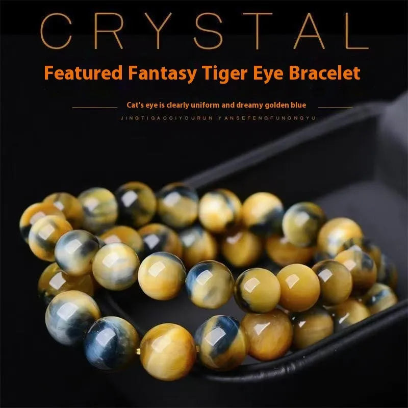 Handmade fantasy tiger eye agate beaded bracelet with 10mm round beads on a wrist.