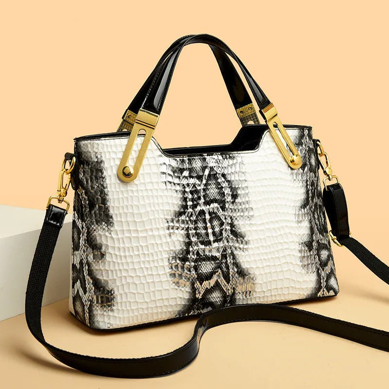 Black retro style messenger bag with chain detail showing internal phone pocket and file compartment