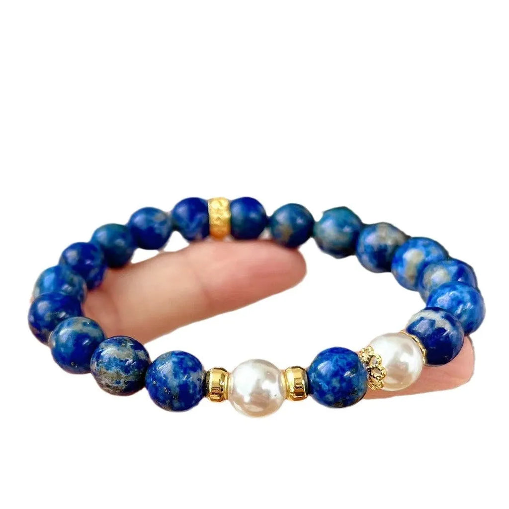 Chinese style artistic retro bracelet made with genuine blue and gold lapis lazuli beads.