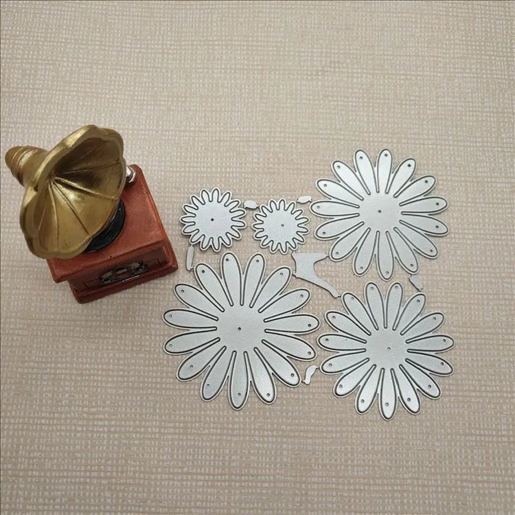 Silver floral design metal cutting die with hanging hook, 12.5cm by 13cm.