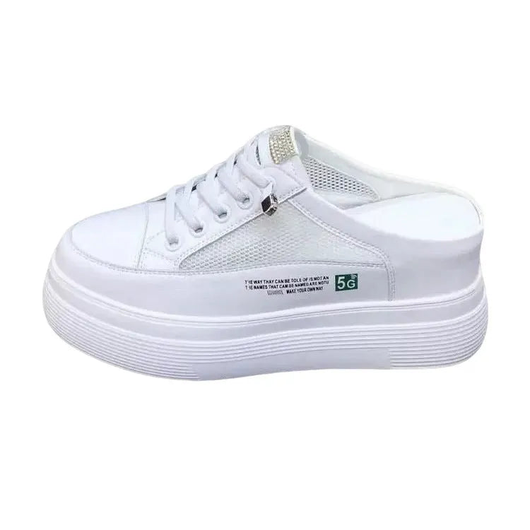 White women's platform shoes with mesh detail and a round toe on a rubber sole.