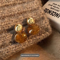 Handmade holiday earrings with three geometric styles: round, irregular, and water drop designs with tassel elements