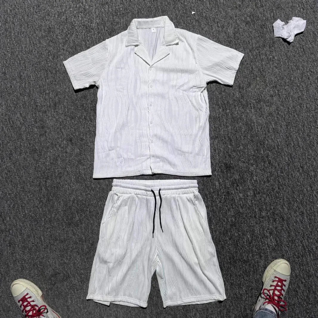 Men's black wave pattern short sleeve shorts suit laid flat showing shirt and matching shorts