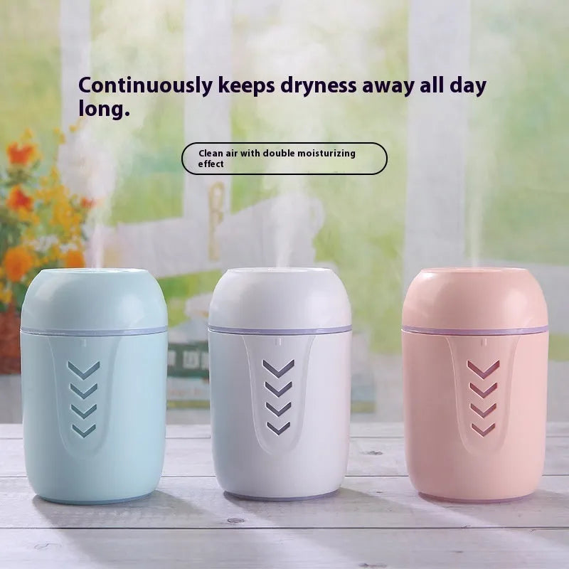 Round portable air purifier in blue, pink, or white with USB cable for vehicle or desktop use