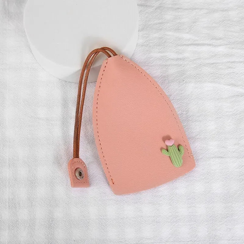 Cartoon pull-out key case in PU leather showing pull-out mechanism and colourful design options