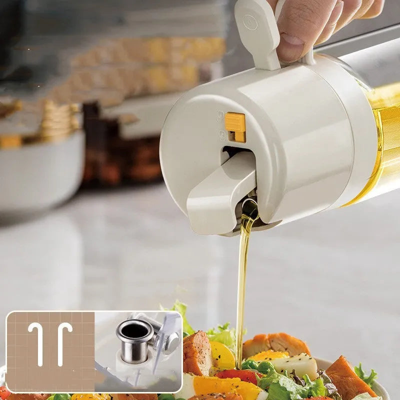 Warm grey glass 2-in-1 oil sprayer and pourer bottle with switchable cap on kitchen counter
