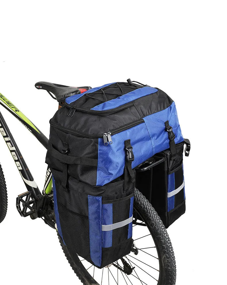 Rhinoceros brand 70-litre capacity bicycle rear frame storage bag in blue, mounted on a bike for touring.