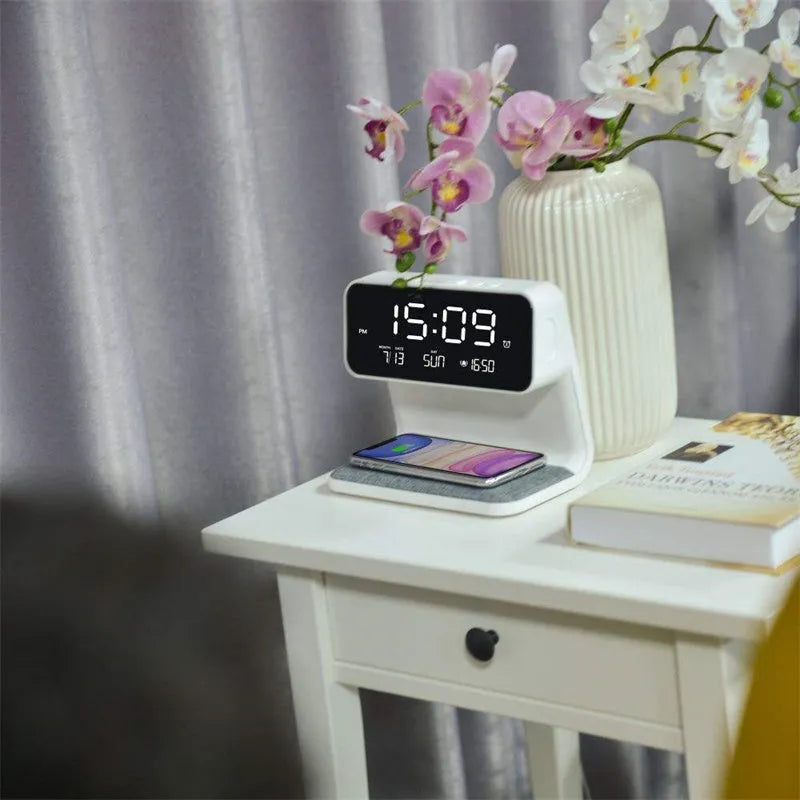 White bedside lamp with integrated wireless charging pad, LCD alarm clock screen, and touch-sensitive dimming controls.