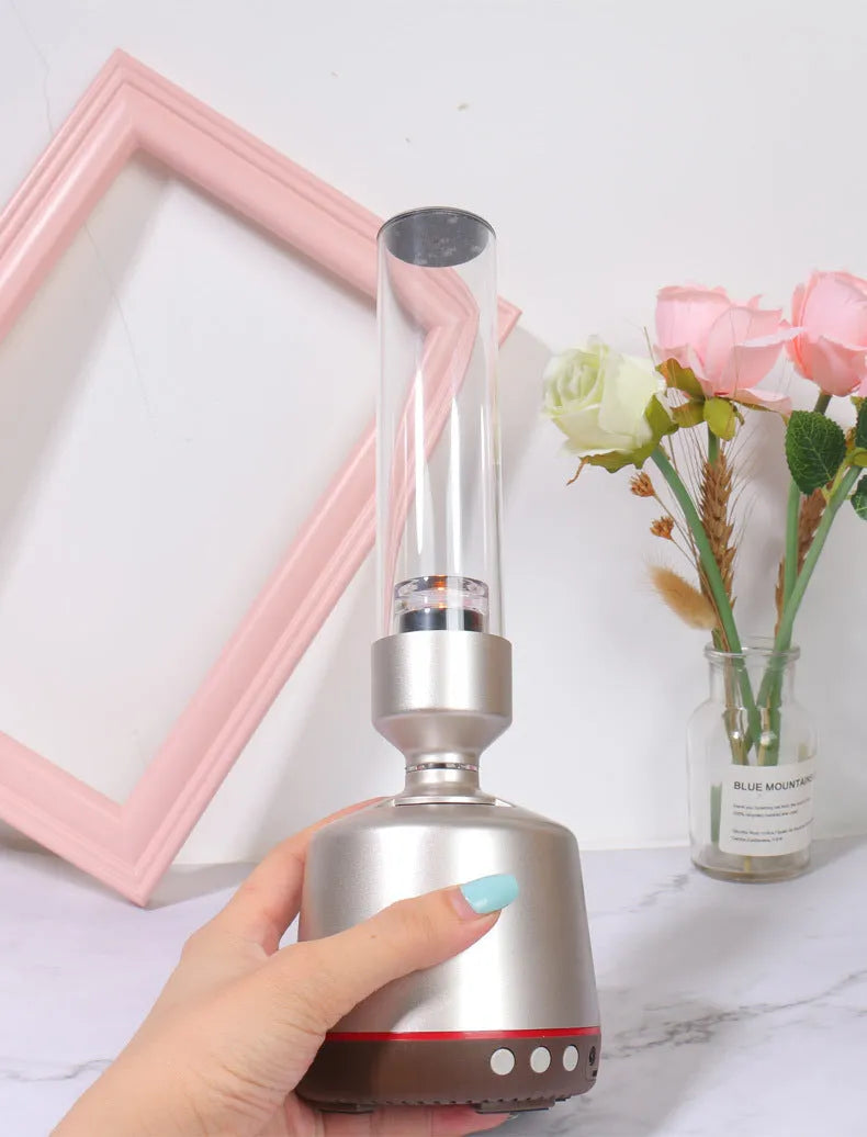 White silver Bluetooth speaker with candlelight-style lighting, 90x277mm dimensions