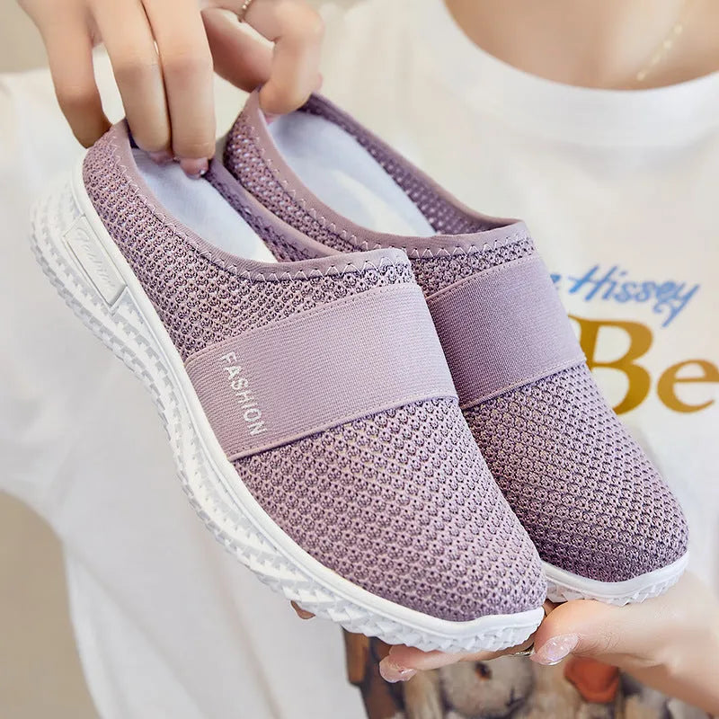 A pair of women's breathable casual flat shoes with a mesh upper and hollow-out design, shown in a choice of colours.