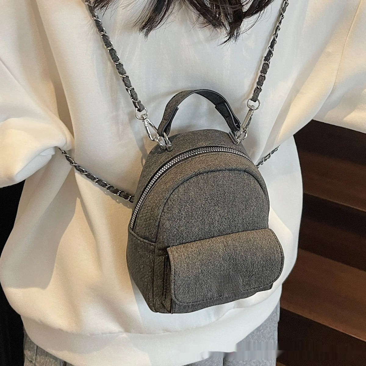 Korean style solid colour PU casual backpack with three-dimensional pocket, shown in black, beige, blue, dark blue or khaki.