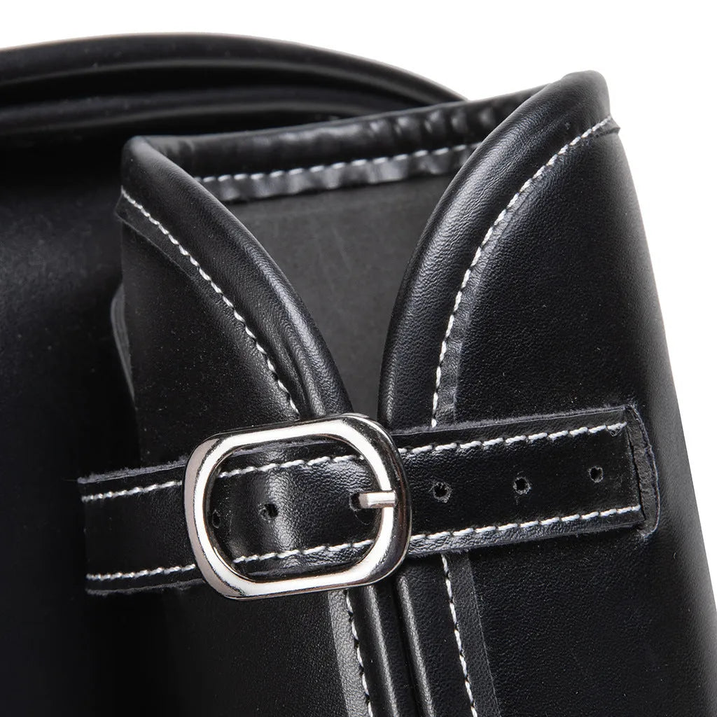 Dark punk motorcycle tail bag with coded lock mounted on cruiser motorcycle