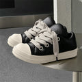 Men's black leather slip-on shoes with flat sole and front lace-up