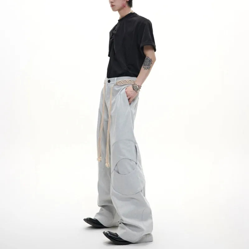 Men's cotton straight-leg trousers with micro-elastic fabric, zipper decorations, and tassel details in dark colour options