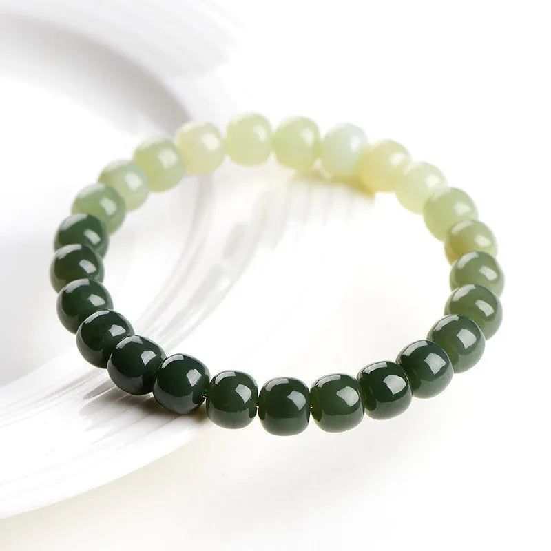Natural Hetian jade bracelet with gradient clear water colours showing polished beads