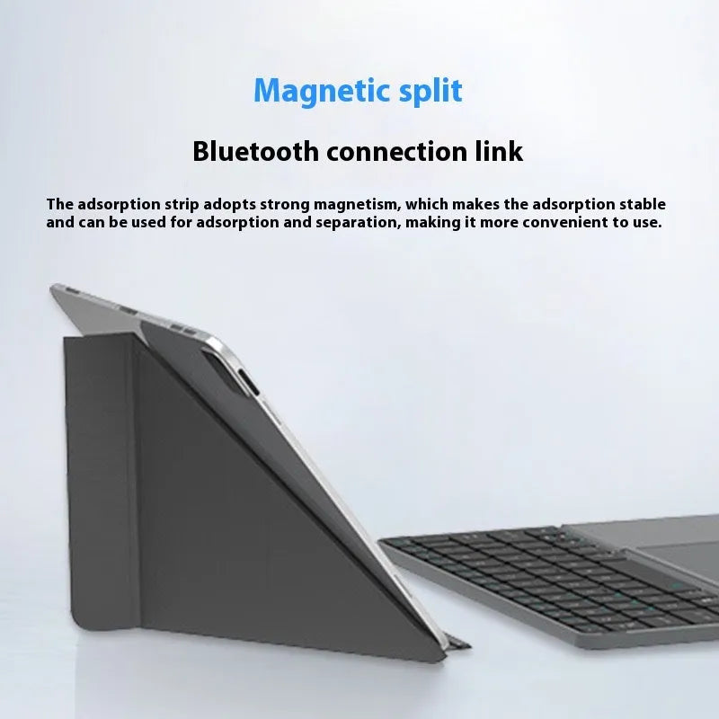 Grey folding Bluetooth keyboard unfolded next to mobile phone showing 60-key layout and compact design