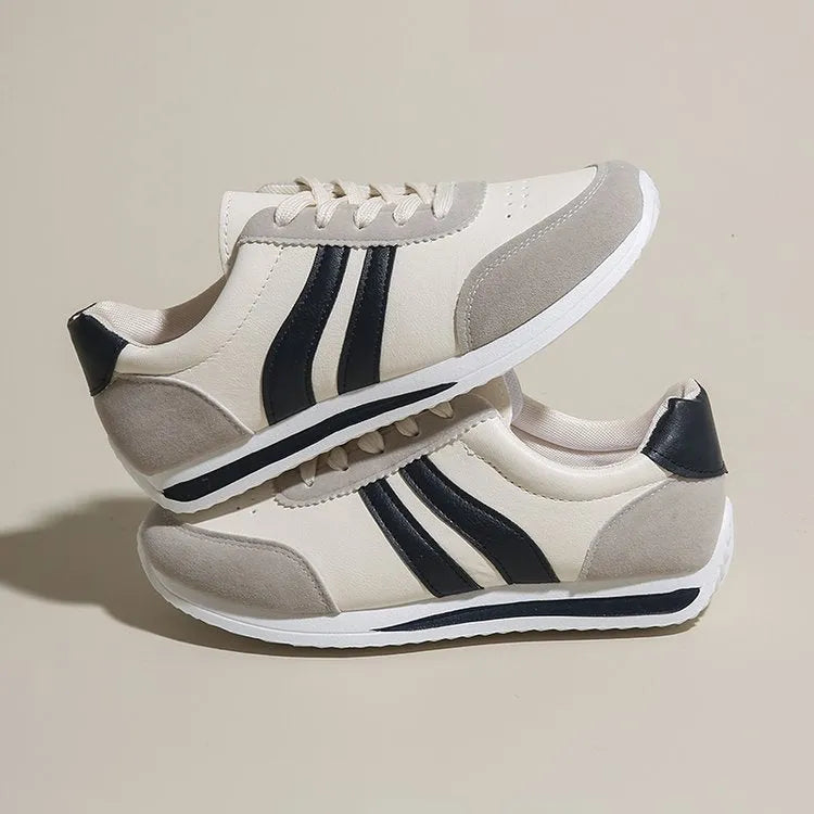 Blue and red low-top lace-up running sneakers with a round toe and rubber sole