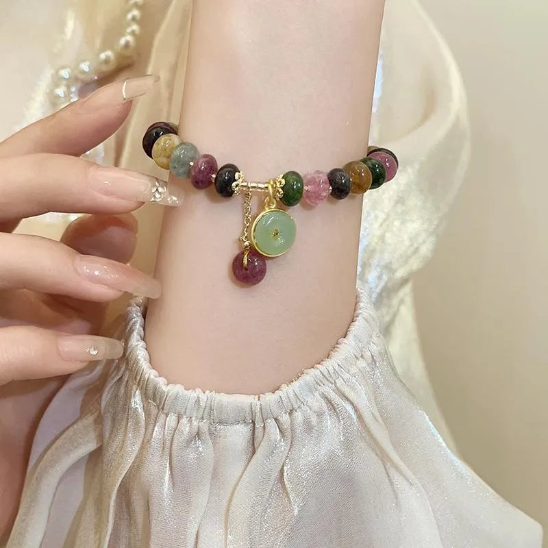 Colourful tourmaline abacus bead bracelet with rabbit pendant on natural stone beads