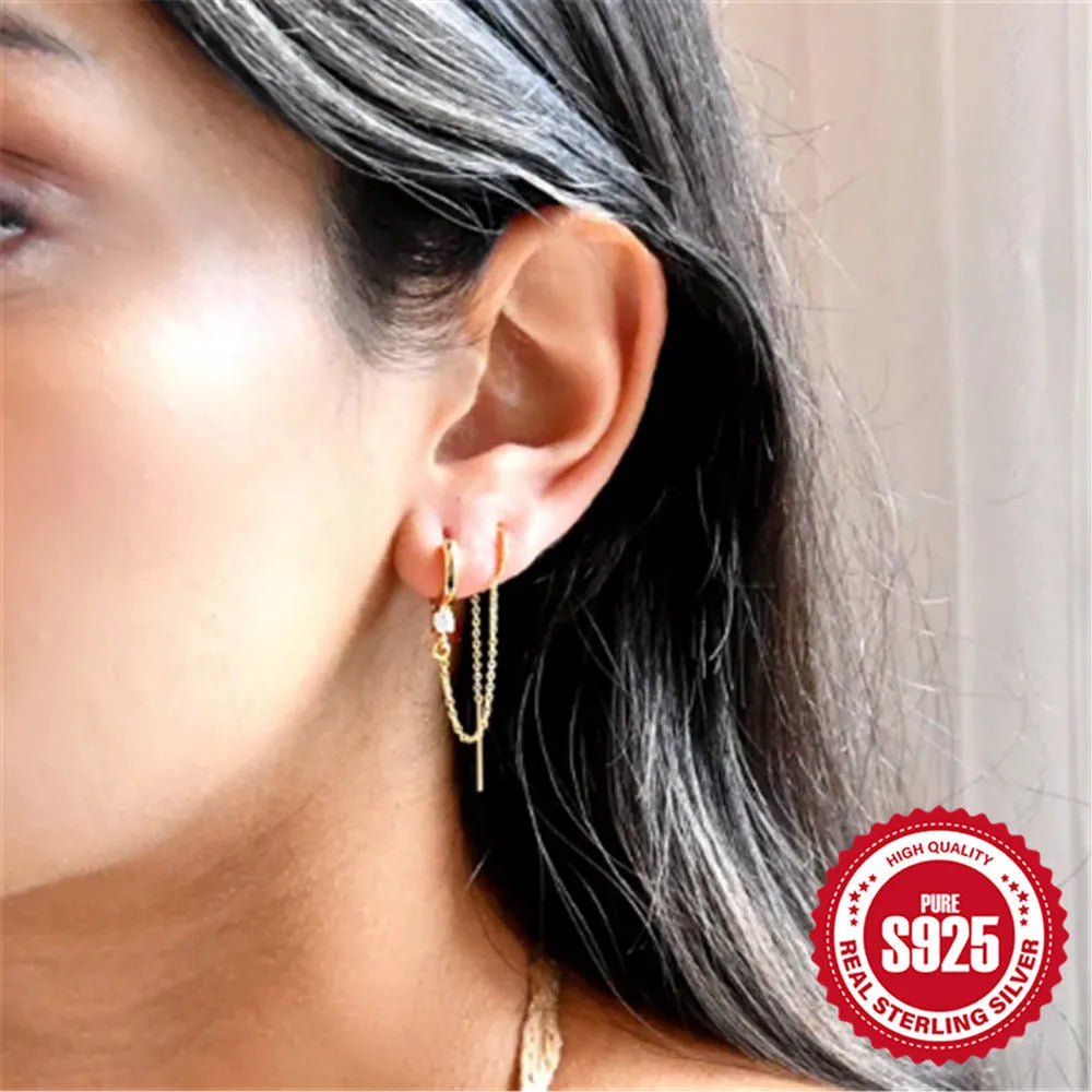 S925 sterling silver earrings with geometric flower tassel design and golden electroplated finish on ear clip mechanism