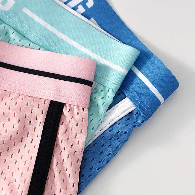 Men's loose fit boxers in Ice Silk fabric shown in black, white, dark grey, blue, pink, or light green.