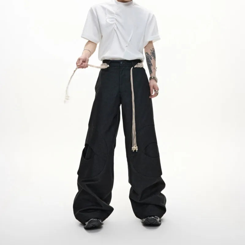 Men's cotton straight-leg trousers with micro-elastic fabric, zipper decorations, and tassel details in dark colour options