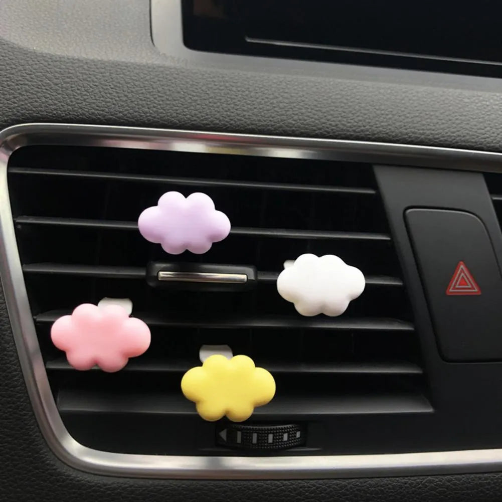 Resin cartoon car fragrance clip in light green colour, dimensions 17mm by 27mm, on a car air vent