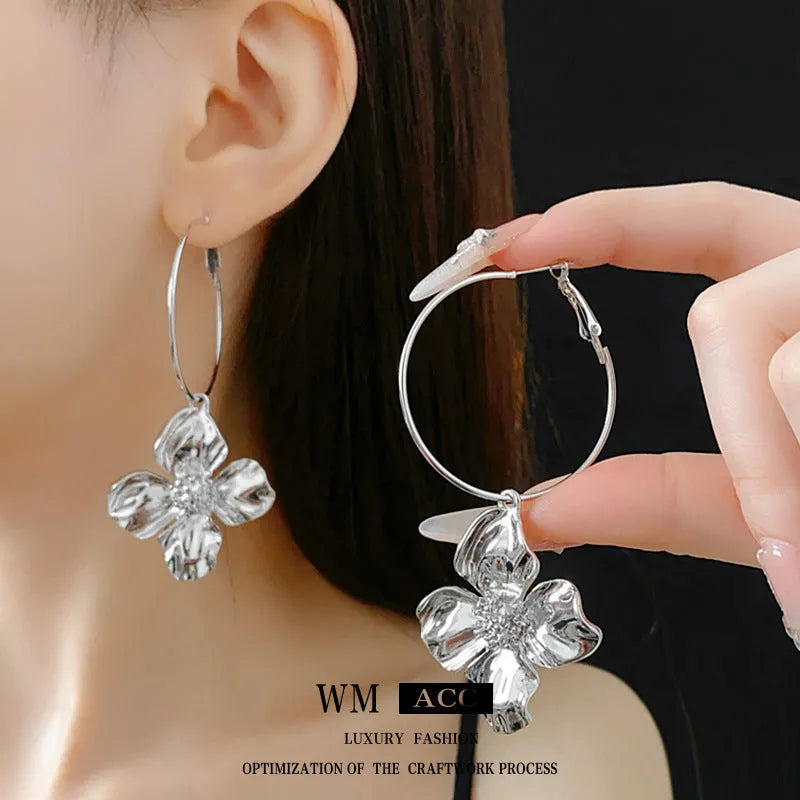 Silver needle metal flower earrings with electroplated gold or silver finish and vintage design