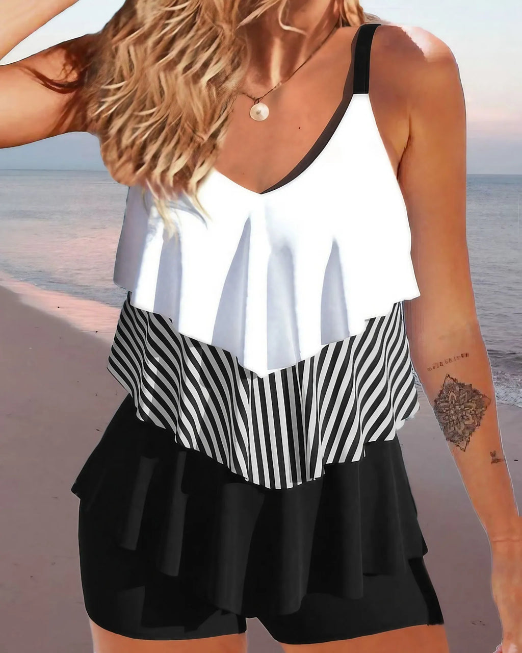 Women's backless spaghetti-strap ruffle bikini swimsuit top and shorts in a floral pattern.