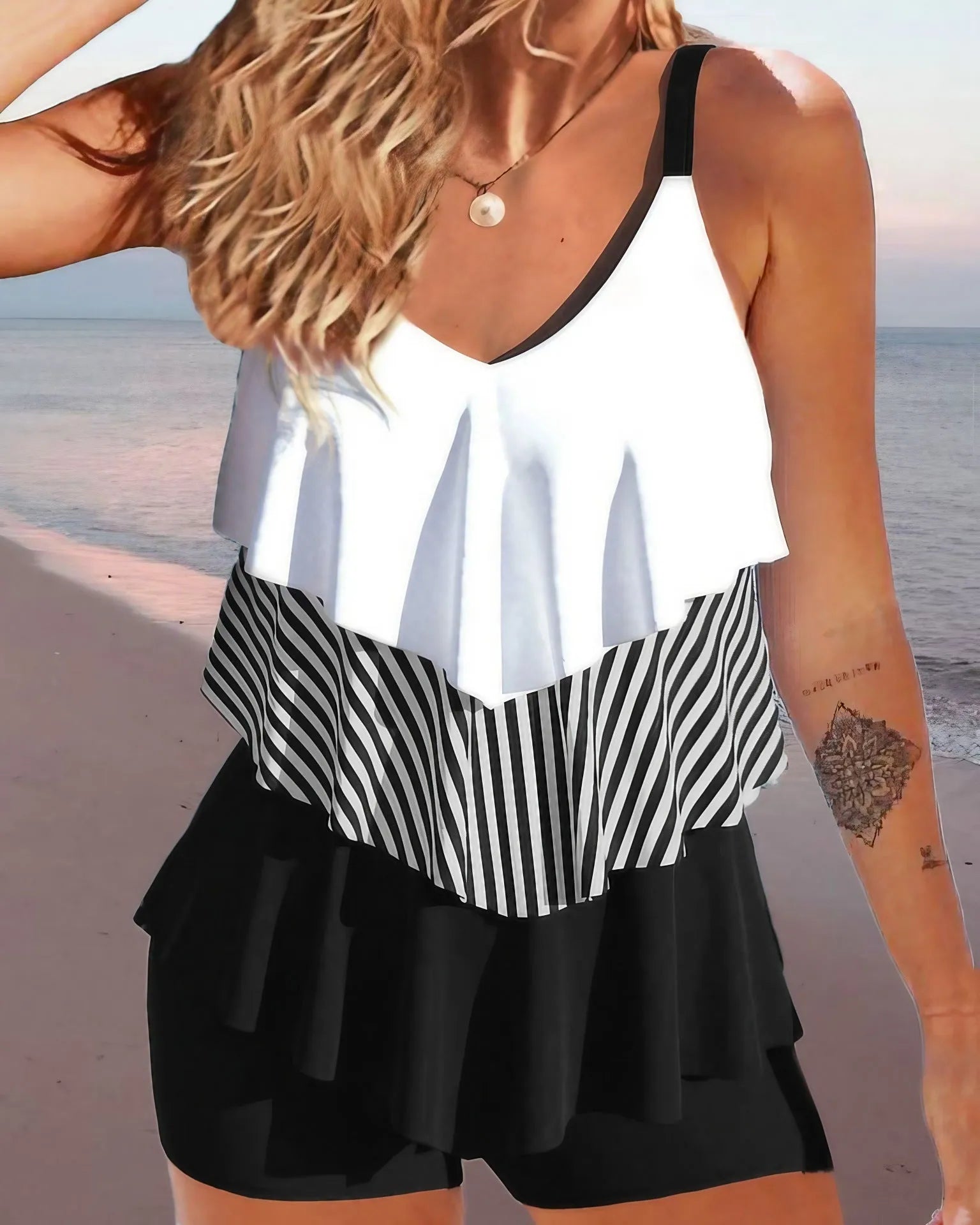 Women's backless spaghetti-strap ruffle bikini swimsuit top and shorts in a floral pattern.