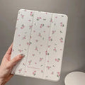 Transparent floral tri-fold protective case for Apple iPad showing magnetic bracket function