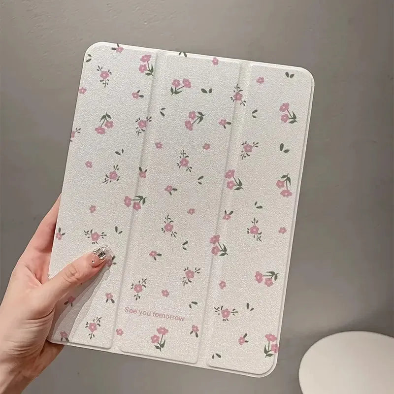 Transparent floral tri-fold protective case for Apple iPad showing magnetic bracket function