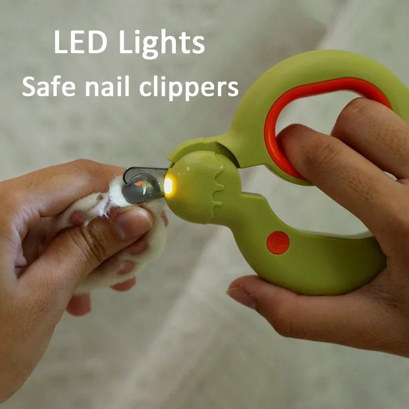 Blue pet nail clippers with LED light for illuminating blood lines during cat and dog grooming