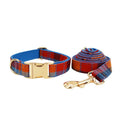 Blue velvet plaid pattern dog collar and matching hand-holding rope leash on a white background.