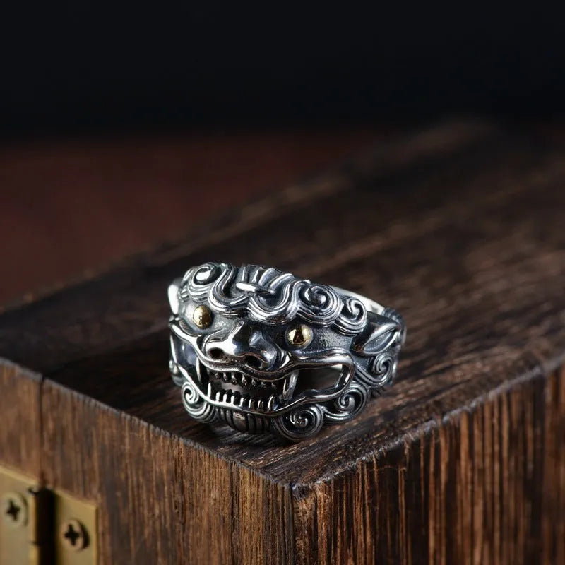 Adjustable open-style sterling silver ring with Jibeast zodiac pattern and diamond accents on finger